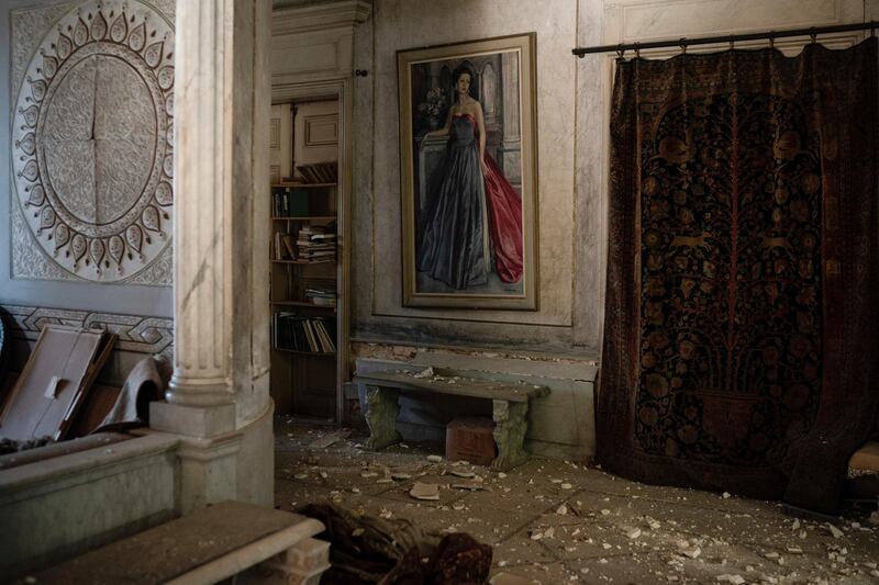 Debris from the ceiling and walls cover the floor of a room in the Sursock Palace. AP Photo