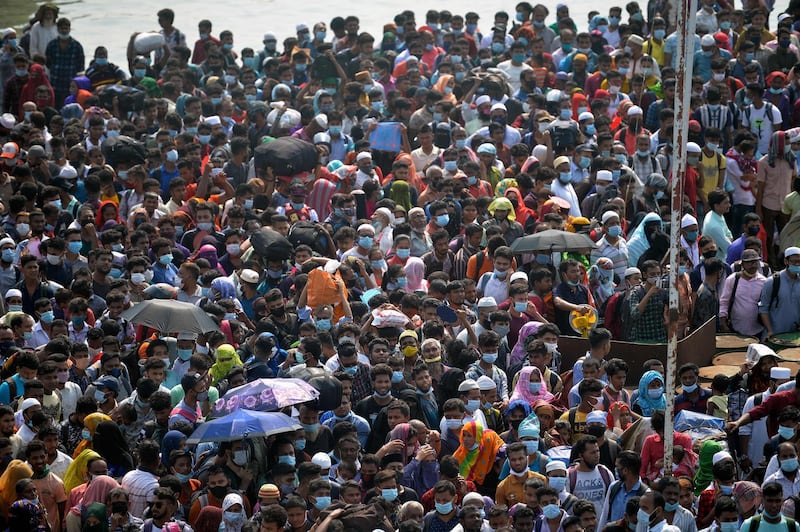 People wait to board a ferry to reach their hometowns ahead of Eid Al Fitr in Munshiganj, Bangladesh. AFP