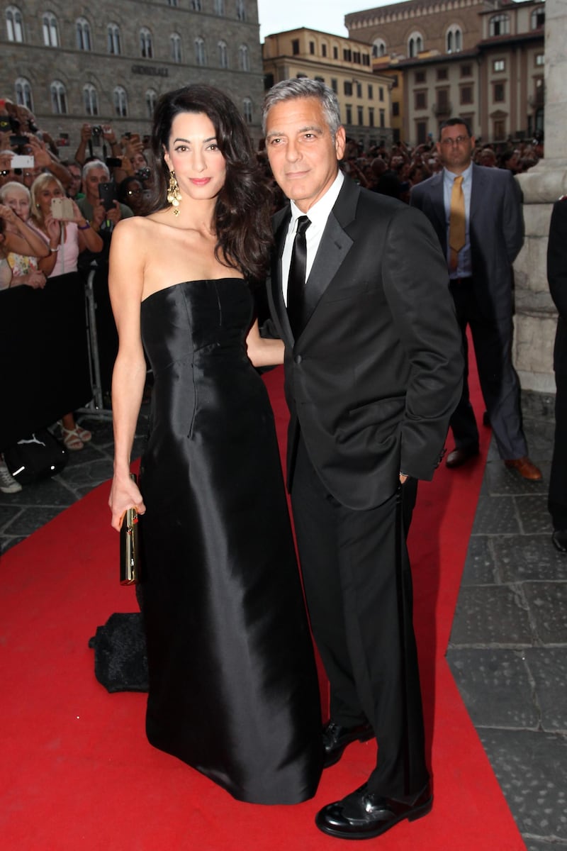 FLORENCE, ITALY - SEPTEMBER 07:  Amal Alamuddin and George Clooney attend the Celebrity Fight Night In Italy Benefitting The Andrea Bocelli Foundation and The Muhammad Ali Parkinson Center Gala on September 7, 2014 in Florence, Italy.  (Photo by Andrew Goodman/Getty Images for Celebrity Fight Night)
