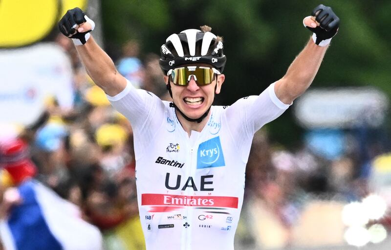 UAE Team Emirates rider Tadej Pogacar celebrates winning the sixth stage of the 109th edition of the Tour de France between Binche in Belgium and Longwy in northern France, on July 7, 2022. AFP