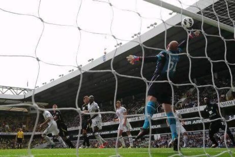 Brad Friedel made several outstanding saves to help Tottenham Hotspur salvage a draw with Norwich City at White Hart Lane, keeping Andre Villas-Boas winless in his start as Spurs manager.
