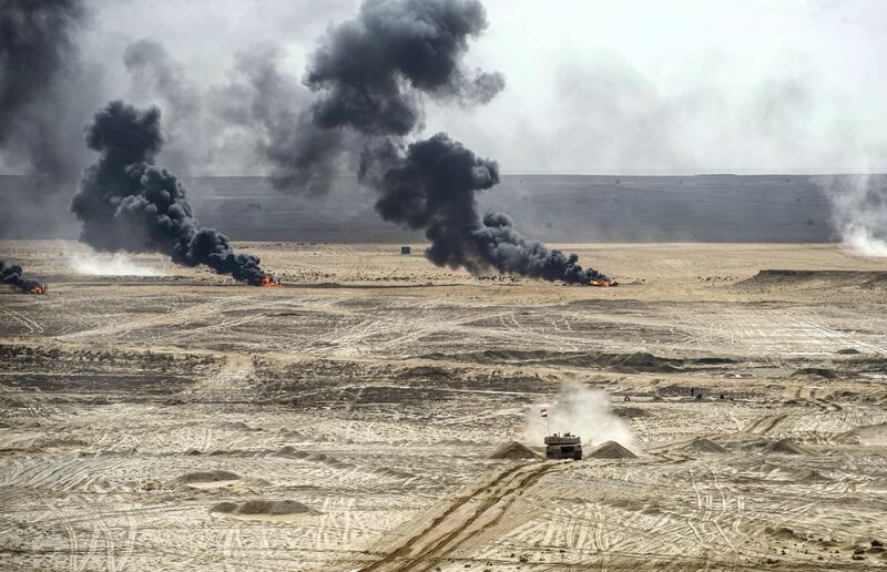 Egyptian tanks take part in the Arab Shield military exercises in the Matrouh Governorate Mohamed Naguib miilitary base, northwest of the capital Cairo on November 15, 2018. - Forces from Saudi Arabia, Egypt, the UAE, Kuwait, Bahrain and Jordan are taking part in the maneuvers. (Photo by Khaled DESOUKI / AFP)