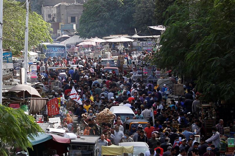 A number of people are seen wearing face masks at a bustling local market in Cairo, Egypt. Reuters