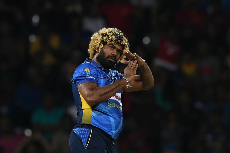 Sri Lanka's captain Lasith Malinga signals for a TV Umpire review during the third and final international Twenty20 cricket match between Sri Lanka and New Zealand at the Pallekele International Cricket Stadium in Kandy on September 6, 2019 / AFP / LAKRUWAN WANNIARACHCHI
