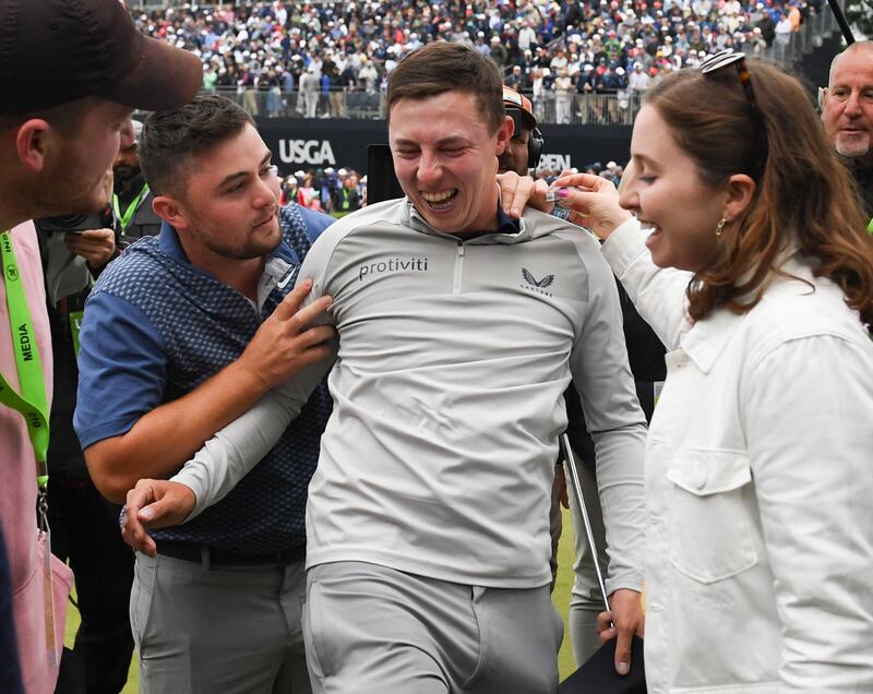 Matt Fitzpatrick of England is embraced by his brother Alex. EPA