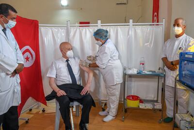 Tunisian President Kais Saied receives his Covid-19 vaccine in Tunis. 