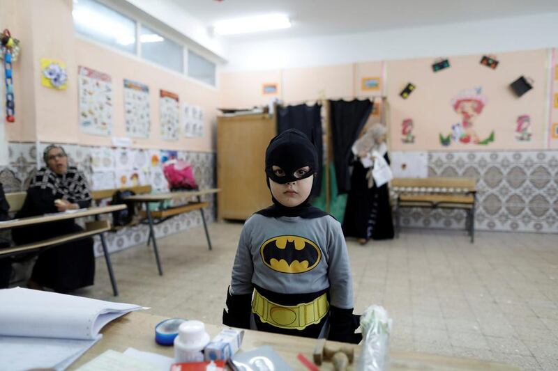 A boy in a Batman costume stands at a polling station during the parliamentary election in Algiers, Algeria. Zohra Bensemra / Reuters / May 4, 2017