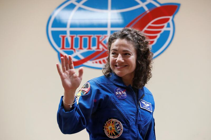 Jessica Meir waves at the final news conference. Shamil Zhumatov / Reuters