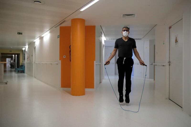 Medical worker Mohamed jumps rope as he attend a training session with French boxer Hassan N’Dam at the Villeneuve-Saint-Georges hospital, outside Paris. AP Photo