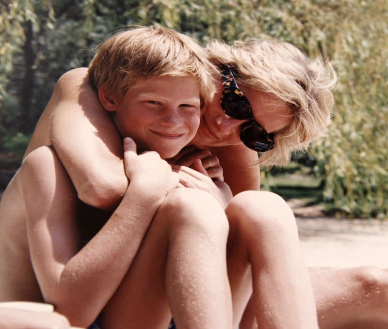 In this photo made available by Kensington Palace from the personal photo album of the late Diana, Princess of Wales, shows the princess and Prince Harry on holiday, and features in the new ITV documentary 'Diana, Our Mother: Her Life and Legacy.' Prince William and Prince Harry will pay tribute to their mother, Princess Diana, as the 20th anniversary of her death in a car crash approaches in a TV documentary â€œDiana, Our Mother: Her Life and Legacyâ€ which will air Monday July 24, 2017 on British TV. (The Duke of Cambridge and Prince Harry/Kensington Palace via AP)  NO USE ON THE FRONT COVERS OF ANY UK OR INTERNATIONAL MAGAZINES. NO COMMERCIAL USE (including any use in merchandising, advertising or any other non-editorial use including, for example, calendars, books and supplements).