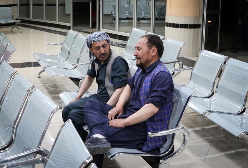 An Afghan man grieves at a hospital in Kabul after explosions at a school killed at least 50 people and injured scores. EPA