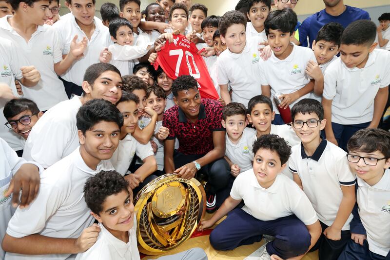 Shabab Al Ahli and UAE winger Yahya Al Ghassani returns to his old high school, Dubai Carmel School, Al Nahda, Dubai to display the Adnoc Pro League title. All photos: Chris Whiteoak / The National