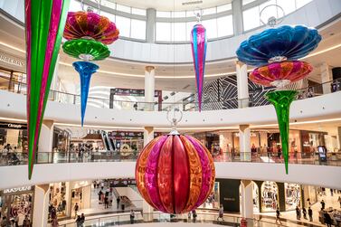 The Dubai Mall has the world's largest Christmas decoration bauble on display. Antonie Robertson / The National