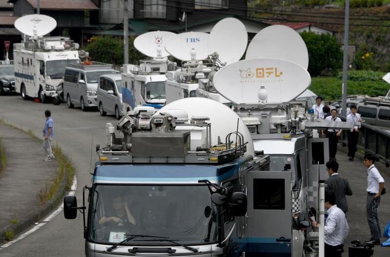 Broadcast vehicles are seen parked near the Tsukui Yamayuri En care centre. Toshifumi Kitamura / AFP Photo