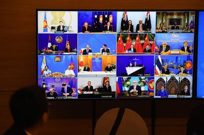 Representatives of signatory countries are pictured on screen during the signing ceremony for the Regional Comprehensive Economic Partnership (RCEP) trade pact at the ASEAN summit that is being held online in Hanoi on November 15, 2020. / AFP / Nhac NGUYEN
