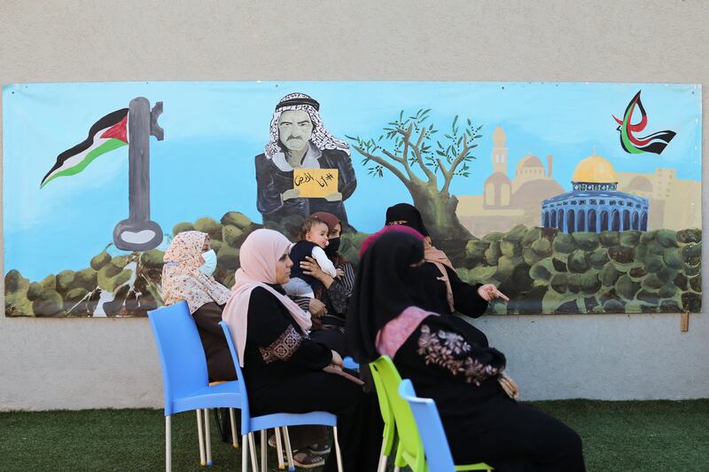 Palestinian women take part in the breast cancer awareness campaign.