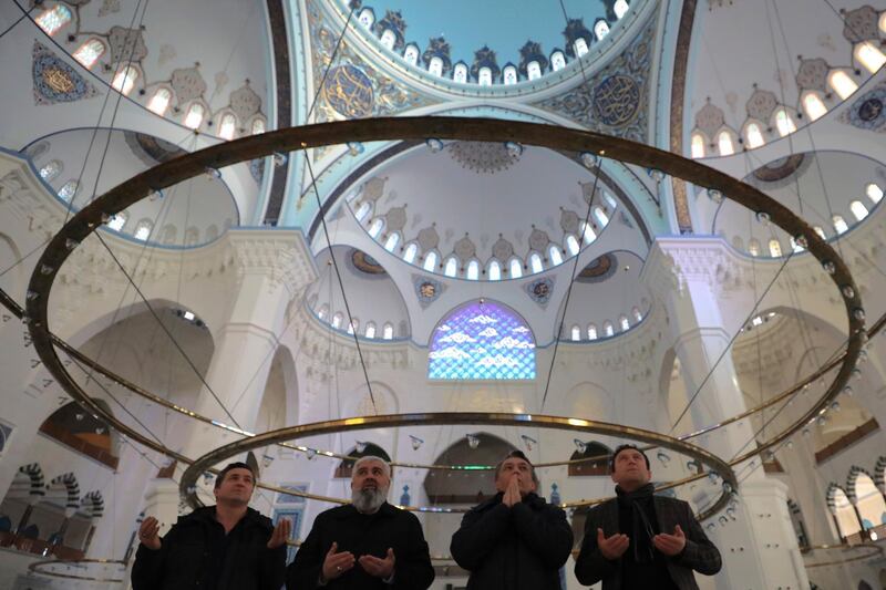 Men pray at the Camlica mosque in Istanbul. AP Photo