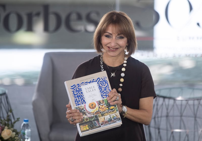 Hanan Sayed Worrel, author of 'Table Tales, The Global Nomad Cuisine of Abu Dhabi' showing her book at the Forbes 30/50 Summit.