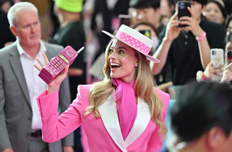 Australian actress Margot Robbie meets fans at a pink carpet event in Seoul to promote her new film Barbie. AFP