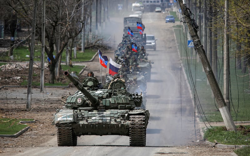 An armoured convoy of pro-Russian troops moves along a road in the southern port city of Mariupol on April 21. Reuters