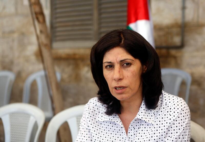 Khalida Jarrar, a Palestinian Member of Parliament (MP) from Ramallah, speaks during an interview with Reuters at her solidarity tent erected outside the headquarters of the Palestinian parliament in the West Bank city of Ramallah August 21, 2014. Palestinian lawmakers have accused Israel of an anti-democratic crackdown as the Gaza war rages, with dozens of elected officials detained, placed under investigation or restricted in their movements. In the latest move, Jarrar, a member of the Popular Front for the Liberation of Palestine - a party with an armed wing that is regarded as a terrorist group by Israel - said she was woken up by Israeli troops in the early hours of Wednesday and told she had 24 hours to leave the city and move to Jericho, in the desert. The military said Jarrar had been "actively inciting for violent actions against Israel". Picture taken August 21, 2014. REUTERS/Mohamad Torokman (WEST BANK - Tags: POLITICS CIVIL UNREST CONFLICT) - RTR43DVI