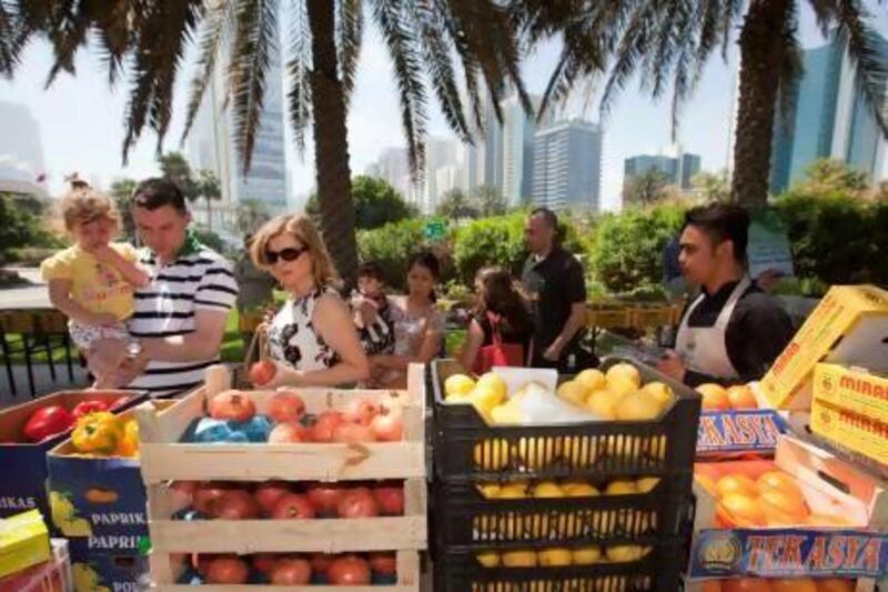 Visitors at a market organised by Baker and Spice at the gardens of Emirates Towers. Jaime Puebla / The National
