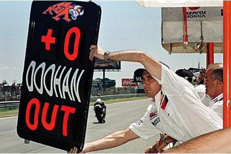 A pit lane board signals Mick Doohan has crashed out of the 1992 Dutch Grand Prix. He was hours away from losing his leg to gangrene.