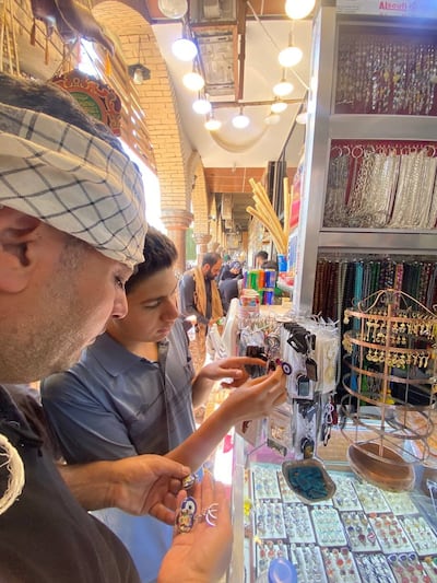 Foreign pilgrims shop for souvenirs in Karbala, south of Baghdad. Photo: Ameer Bashir