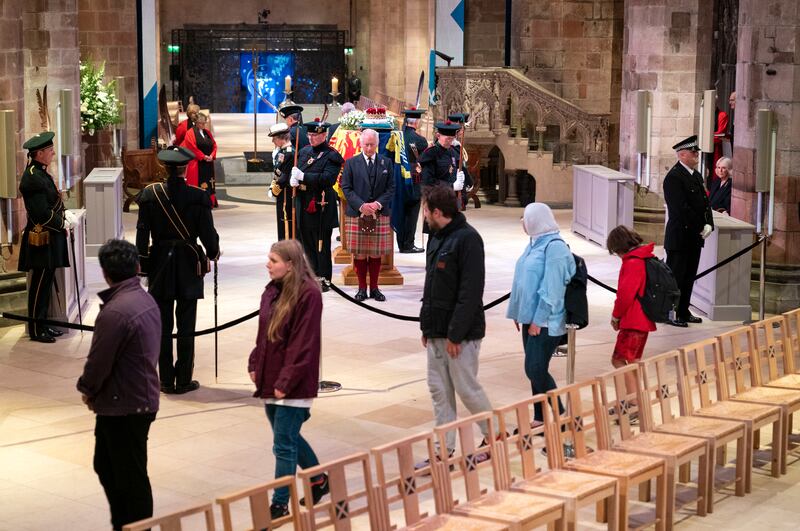 King Charles III, Prince Edward, Princess Anne and Prince Andrew hold a vigil at St Giles' Cathedral as members of the public walk past. Getty Images