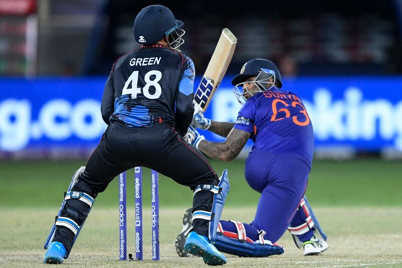 Suryakumar Yadav plays a shot next to Namibia wicketkeeper Zane Green. AFP