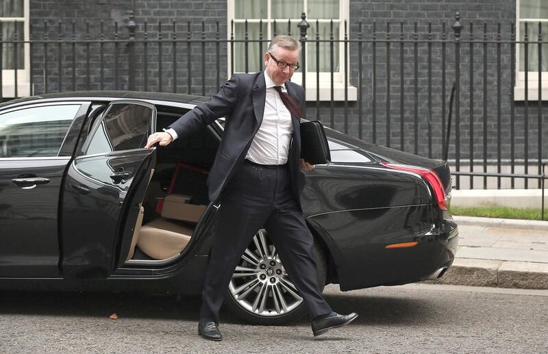 The UK education secretary Michael Gove arrives at 10 Downing Street in London on Monday after being called to attend a meeting with prime minister David Cameron to discuss the alleged "extremist takeovers" of schools in Birmingham. Dan Kitwood / Getty Images)