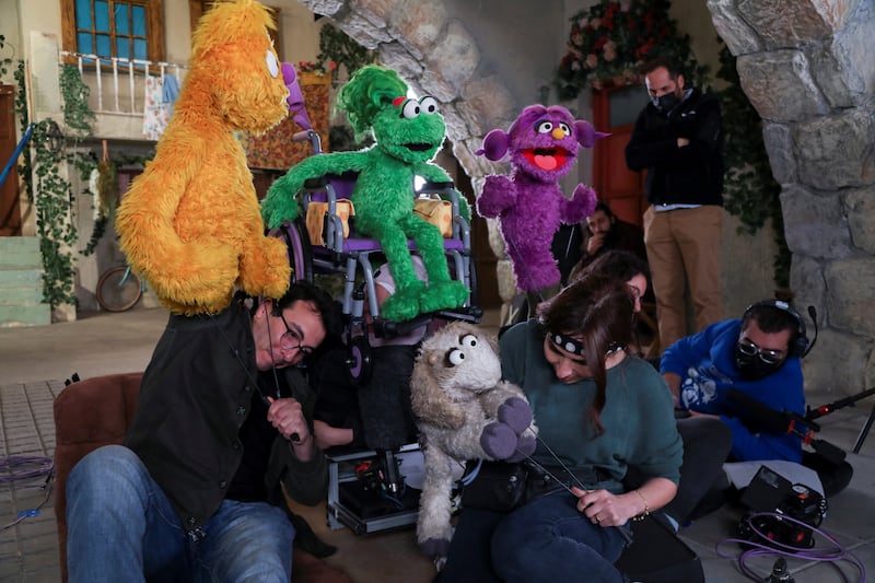 Puppeteers and their characters on the set in a studio in Amman, Jordan.