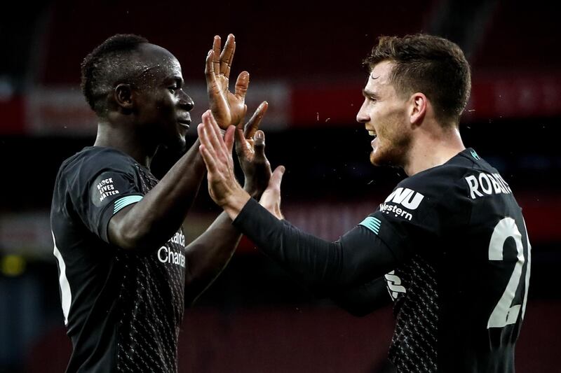 Liverpool's Sadio Mane (L) celebrates with his teammate Andrew Robertson (R) after scoring the opening goal. EPA