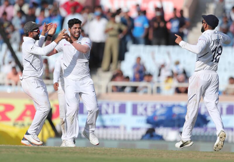 India's Umesh Yadav, second left, celebrates after taking the wicket of  of South Africa batsman Heinrich Klaasen. AP