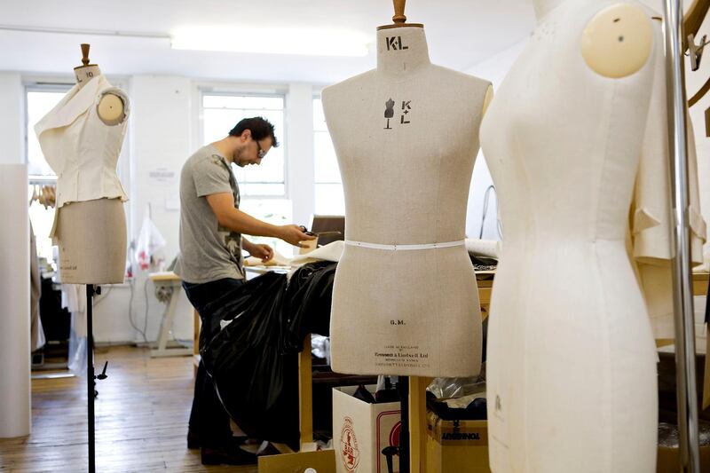 London, August 14 2008. A cutter at work at fashion label Qasimi, at the company's East London studio. Qasimi is run by Elliott Frieze and Khalid Alqasimi. (Matt Crossick)