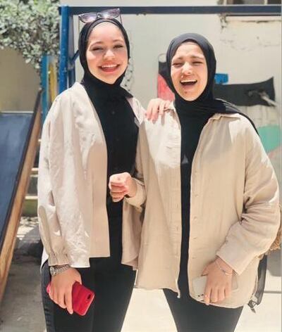 Childhood friends Doha Turkman, left, and Sadil Naghnaghia wearing matching outfits in an undated photo. Photo: Doha Turkman