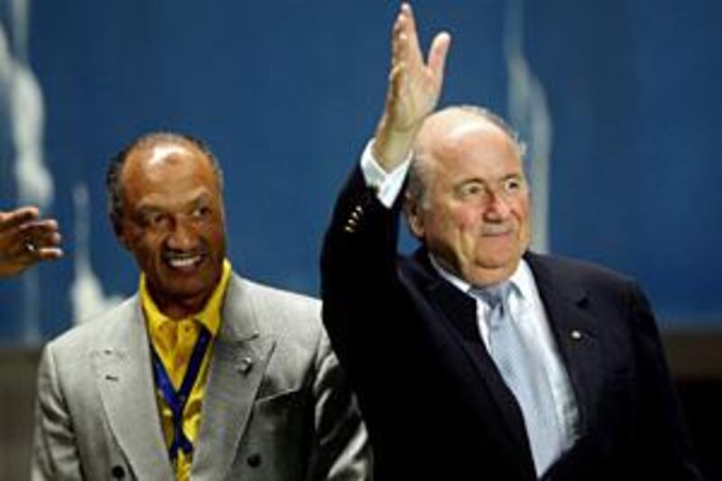 The Fifa president Sepp Blatter, right, has been asked to arbitrate as the race between the current AFC president Mohamed bin Hammam, left, and his challenger Sheikh Salman Al Khalifa hots up.