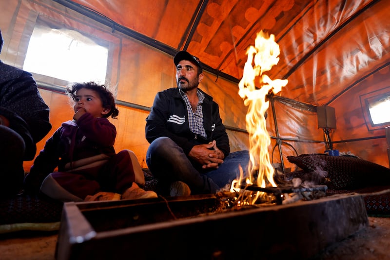 A Palestinian family keeps warm as Israel's Supreme Court rejects a petition challenging the eviction of more than 1,000 Palestinian inhabitants of Masafer Yatta, south of Hebron, in the Israeli-occupied West Bank. All photos: Reuters