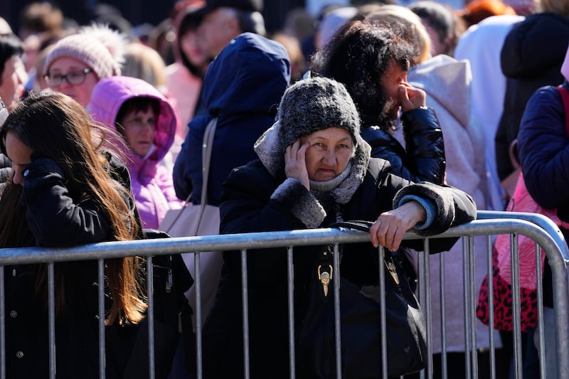 Ukrainian refugees line up to register in Warsaw.  AP