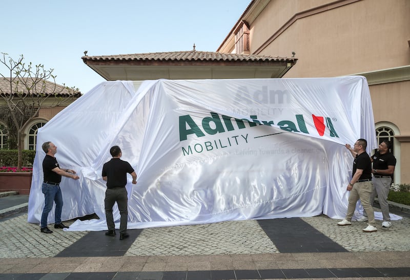 Staff from Dubai-based vehicle manufacturer Admiral Mobility prepare to unveil the company's first fully electric lorries. All photos by Victor Besa / The National