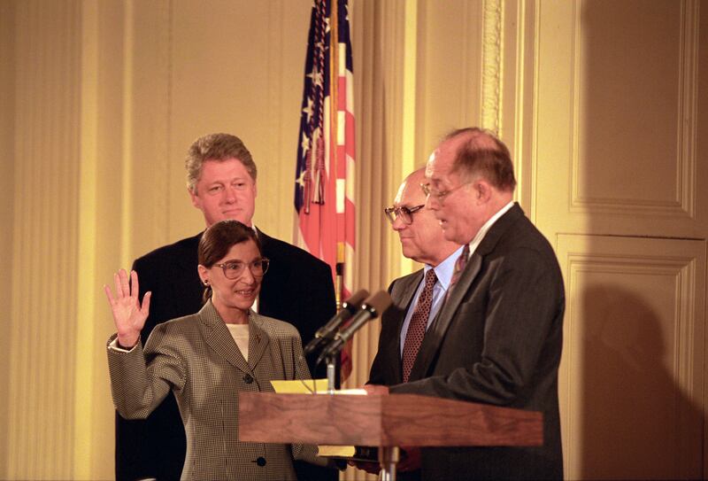 Mr Clinton watches as Ginsburg is sworn in to the Supreme Court. Photo: US National Archives