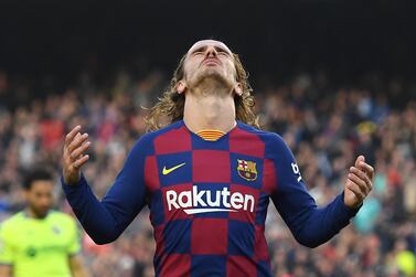 Barcelona's French forward Antoine Griezmann reacts after missing a goal opportunity during the Spanish league football match between FC Barcelona and Getafe CF at the Camp Nou stadium in Barcelona on February 15, 2020. / AFP / Josep LAGO