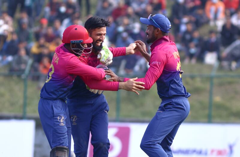 UAE bowler Rohan Mustafa celebrates a wicket.