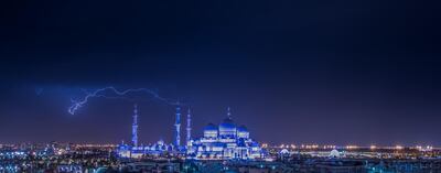 In this photo by Salem Sarhan, lightning flashes above the Sheikh Zayed Grand Mosque in Abu Dhabi