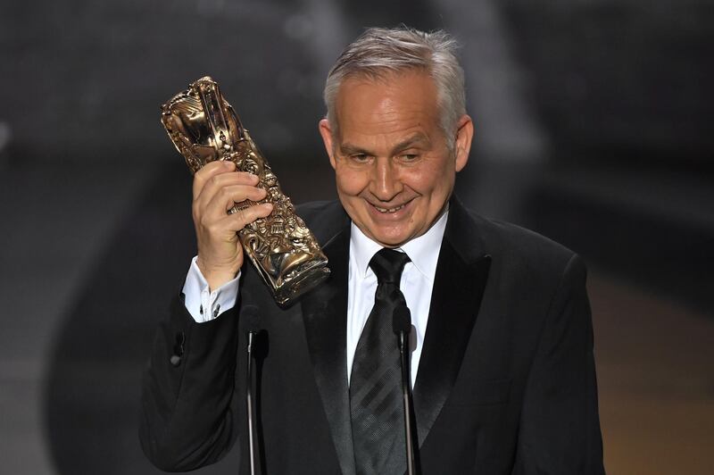 Carlos Conti receives the Best Set Design Award for the film 'Adieu les cons' (Bye Bye Morons) during the 46th Cesar Awards ceremony at the Olympia concert hall in Paris, France. Reuters