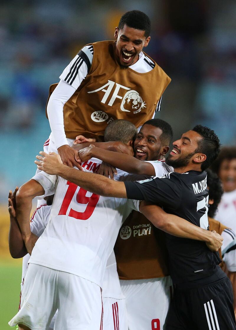 SYDNEY, AUSTRALIA - JANUARY 23:  Ismail Ahmed of the United Arab Emirates celebrates with team mates after scoring the winning goal in a penalty shoot out during the 2015 Asian Cup Quarter Final match between Japan and the United Arab Emirates at ANZ Stadium on January 23, 2015 in Sydney, Australia.  (Photo by Brendon Thorne/Getty Images)