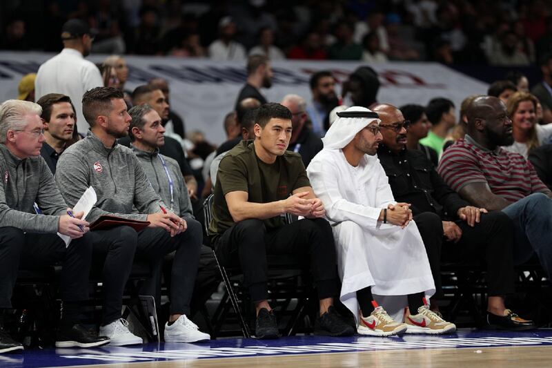 WBA light-heavyweight champion Dmitry Bivol, centre, attends the 2022 NBA Abu Dhabi Games at Etihad Arena on October 8, 2022 in Abu Dhabi. Getty Images