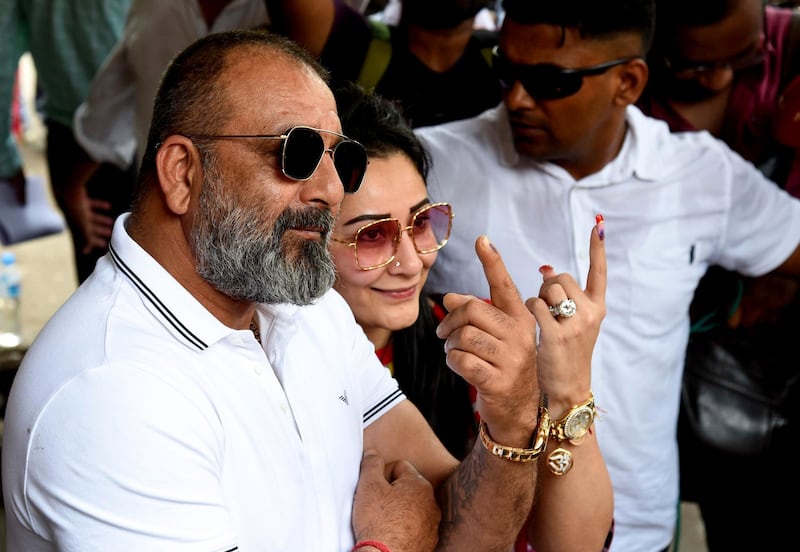 Bollywood actor Sanjay Dutt and entrepreneur wife Manyata Dutt pose for photographs after casting their vote at a polling station in Mumbai on April 29, 2019. AFP
