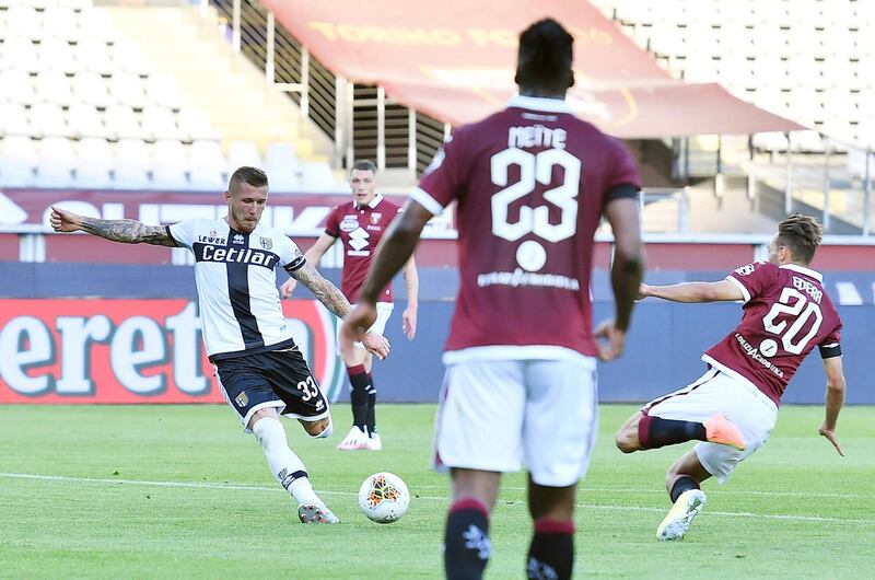Parma's Juraj Kucka (L) scores the equalising goal against Torino. EPA