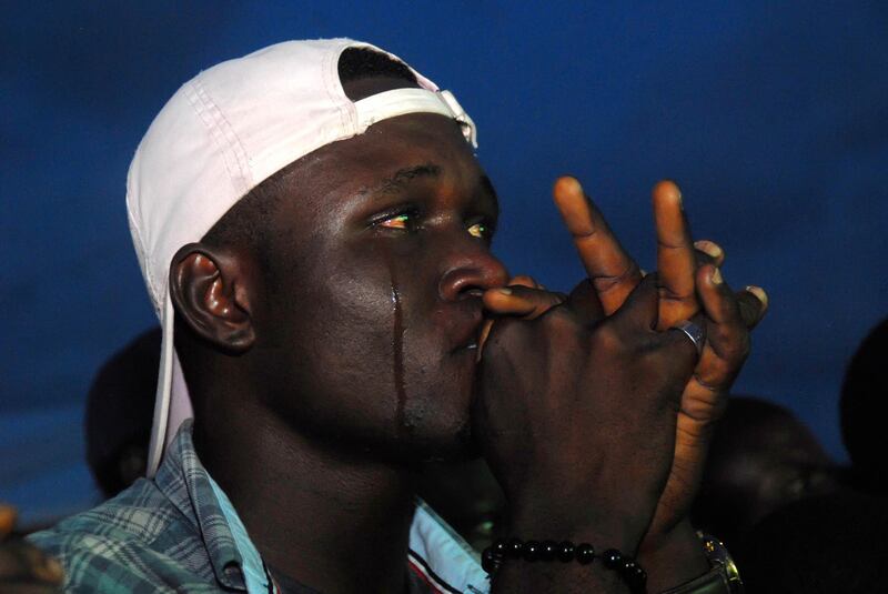 A Nigerian supporter cries in Lagos on June 26, 2018, as he watches the Russia 2018 World Cup football match between Nigeria and Argentina. Segun Ogunfeyitimi / AFP